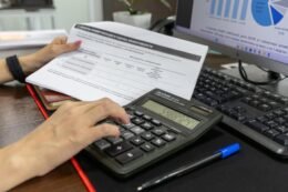 Calculator and financial documents on a desk
